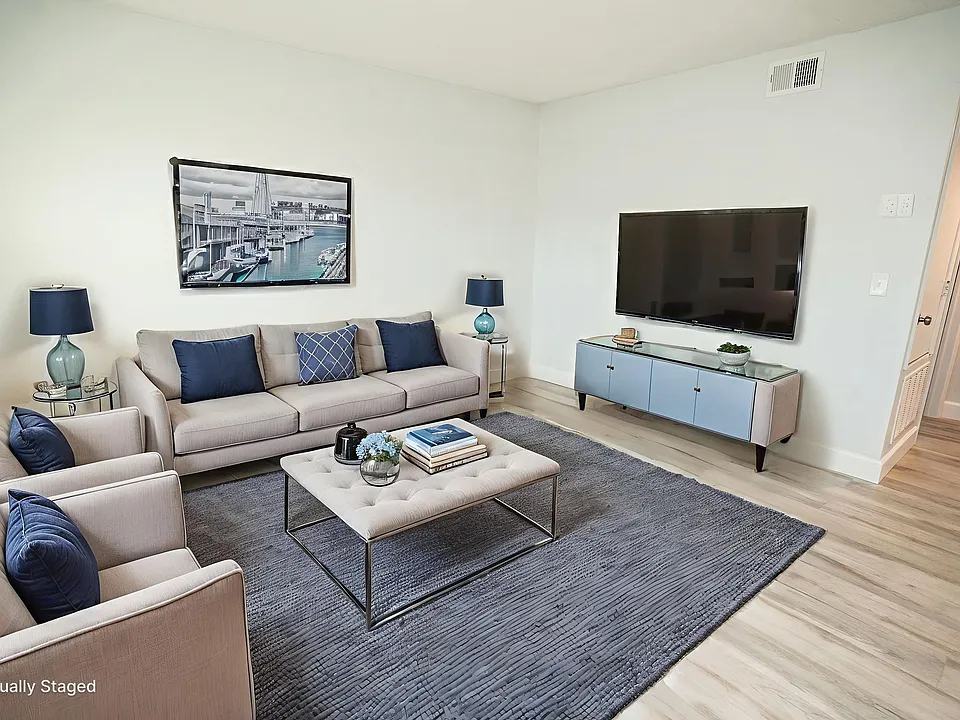 Enjoy a spacious living room with plenty of room to relax, entertain guests, and feel at home.