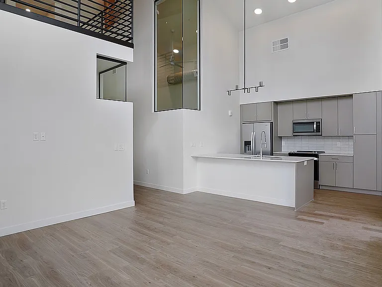 Open-concept living and kitchen space with elevated finishes.