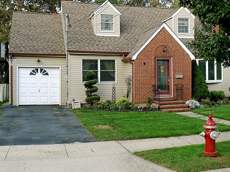 Expanded Cape, new roof and custom gutters