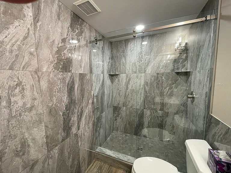 Floor to Celing Porcelain & glass enclosure bathroom