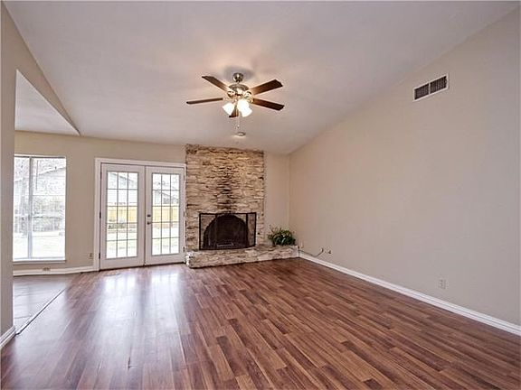 Family room complete with fireplace and new ceiling fan!