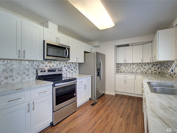 Very roomy galley style kitchen, love the sleek backsplash!