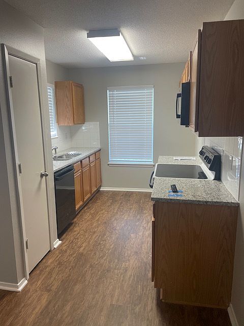 Kitchen with new granite counter tops, new sink, new microwave,