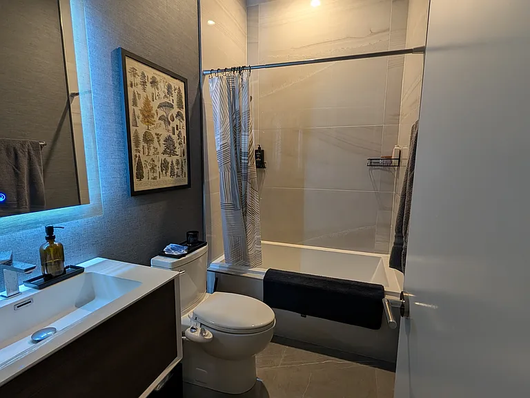 Bathroom with tub, and bidet