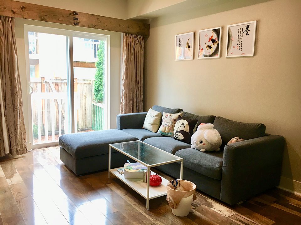 living area featuring easy-access balcony doors for indoor-outdoor flow.