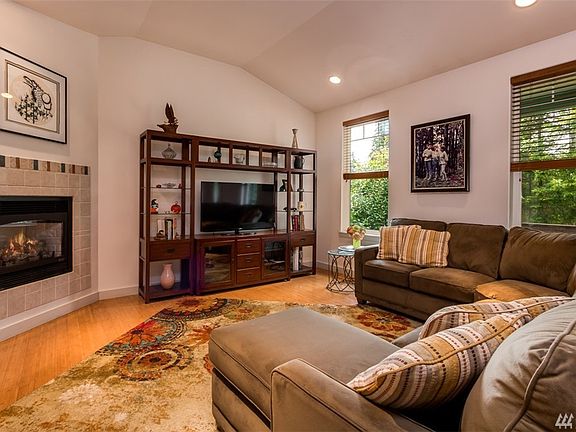 Propane insert fireplace the center of the living room.  Bamboo floors throughout home.