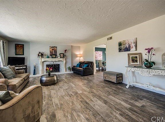 ANOTHER ANGLE OF THE SPACIOUS FORMAL LIVING ROOM