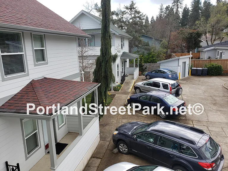 1 reserved parking space in lot, no fee for parking