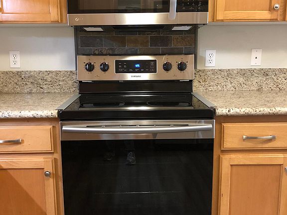 Stainless self cleaning range and microwave vented hood.