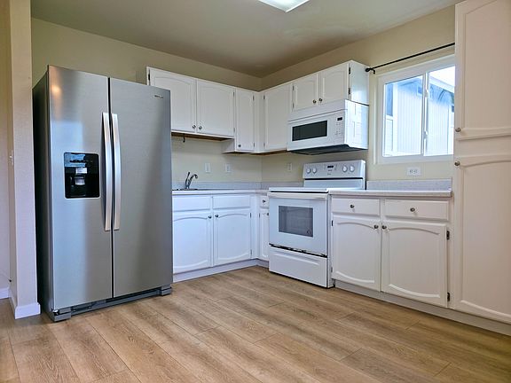 Brand new refrigerator and updated flooring.