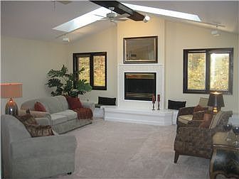 Family Room w/ catherdral ceiling & new carpet