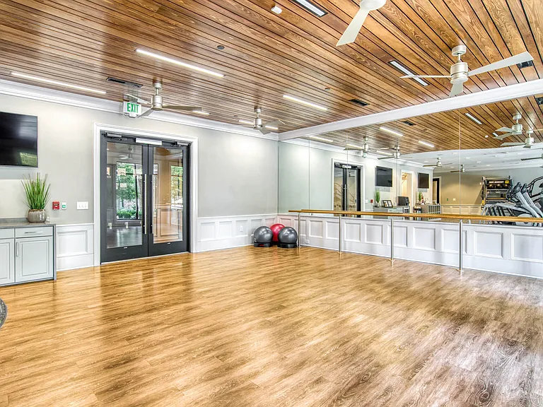 The stretching area is large and equipped with mats and a ballet bar