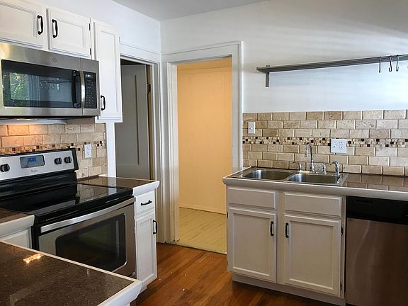 Brand new stainless steel appliances, plus pantry storage off kitchen.