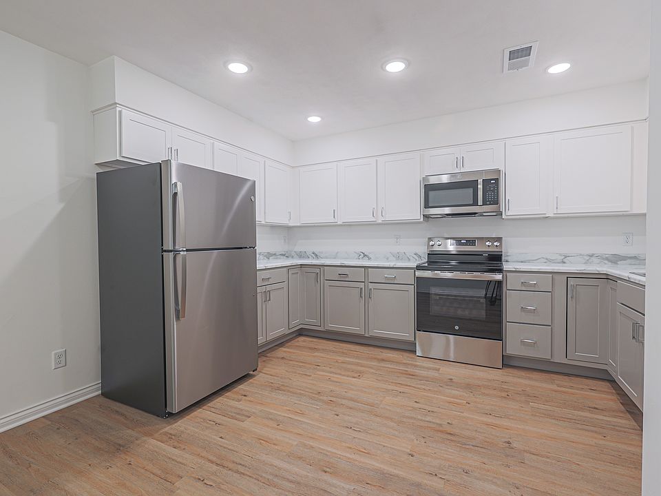 Open Kitchen Area with expansive cabinetry makes it ideal for storage.