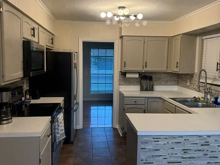 kitchen with door to pantry/storage room