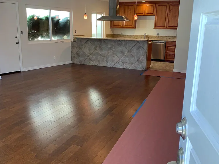 from front door into large great-room toward kitchen & breakfast bar