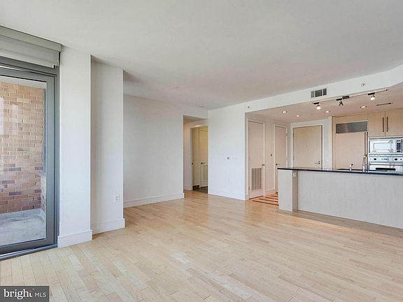 Spacious living room and door to private balcony
