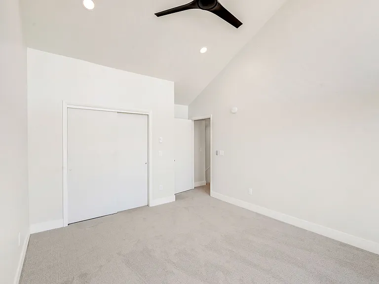 Bedroom #3 - on upper level. Floor to ceiling windows with electric black out window shades.