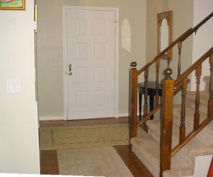 Foyer with hardwood flooring.
