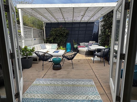 View of the tranquil outdoor patio from the living room.