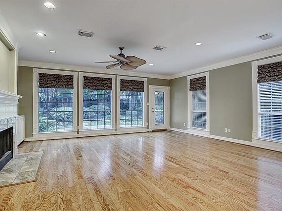 Living Room showing 2 windows that are S-facing. 9' ceilings on 1st & 2nd floors, 10' at 3rd floor game room.