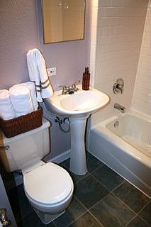 The bathroom is newly remodeled in vintage style