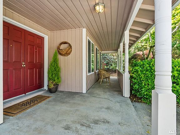 Large covered front porch where you can enjoy the beautiful front Yard. 