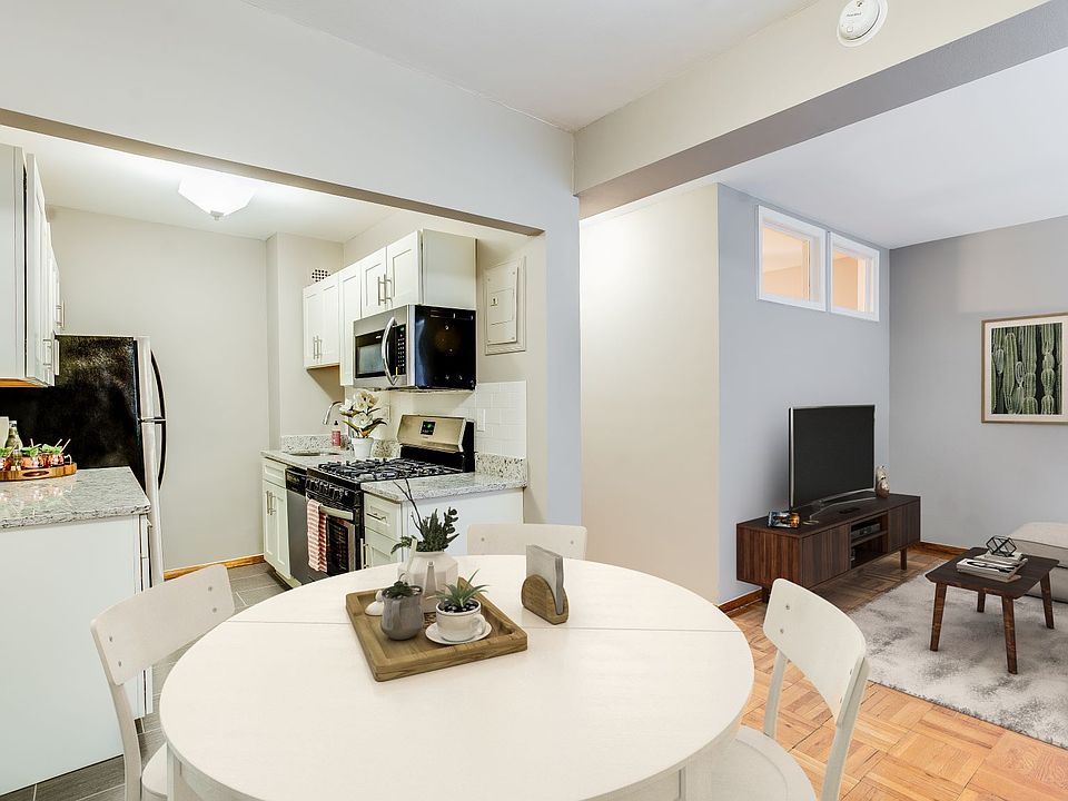 One-bedroom apartment living area (virtually staged)