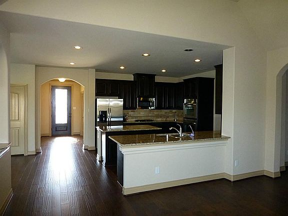 HARDWOOD FLOORS GALORE, GRANITE ISLAND, STAINLESS STEEL APPLIANCES
