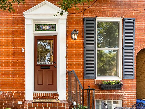 Charming curb appeal with a view of Canton Waterfront Park just steps from your door.
