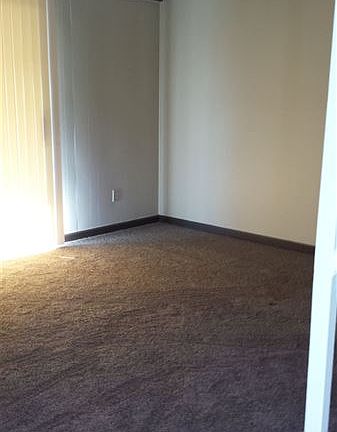 Spacious living room with private patio entrance.
