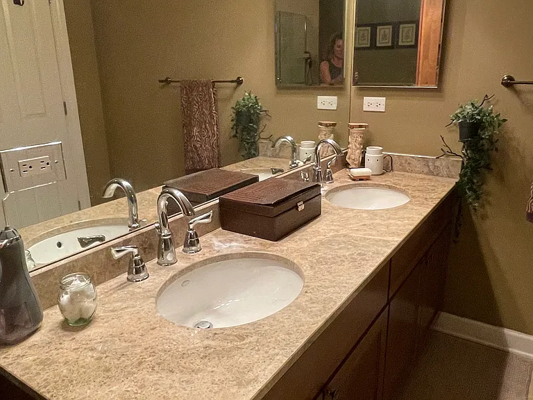 Primary suite bathroom vanity with 2 sinks