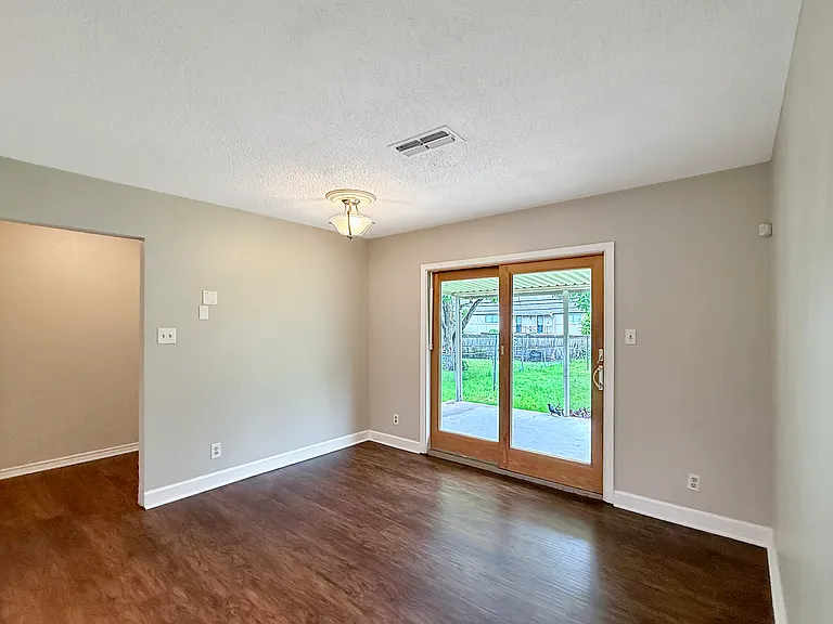 Dining Room w/ sliding door to backyard and covered patio.