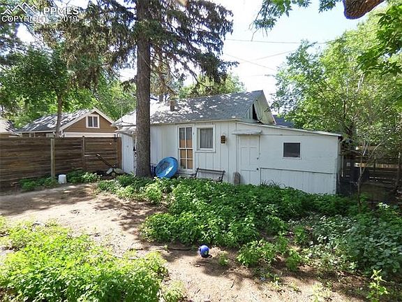 Shot of garage. Appears to have a kitchen and old bathroom. (Nonworking)