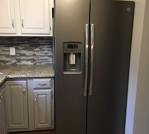Large fridge with water and ice