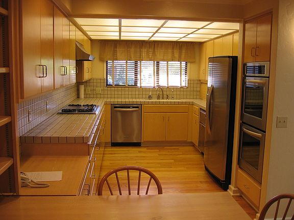 Large kitchen with new stainless steel appliances