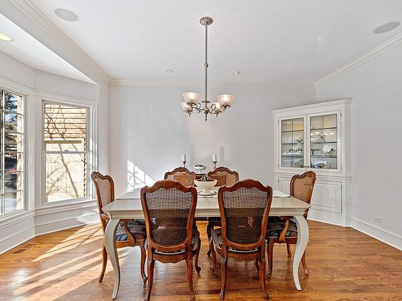 Dining room with built-in and bay window