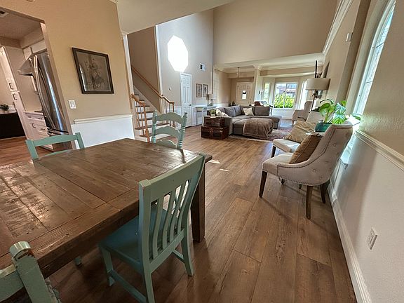 From Dining room looking at front entrance with doorway to kitchen on the left