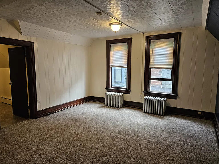 Bedroom, door to left is bathroom