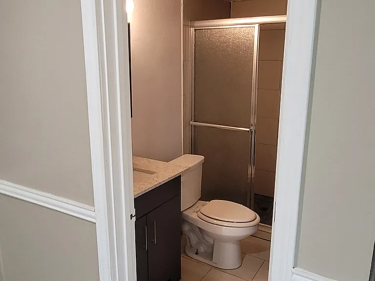 Newly tiled bathroom with shower.