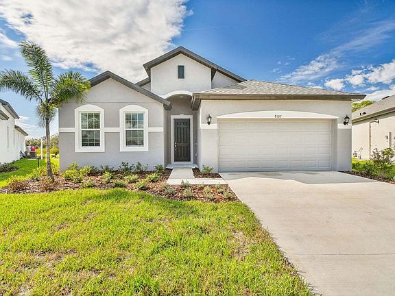 Sanibel quick move-in new construction home front exterior view at Tea Olive Terrace Palmetto, FL by
