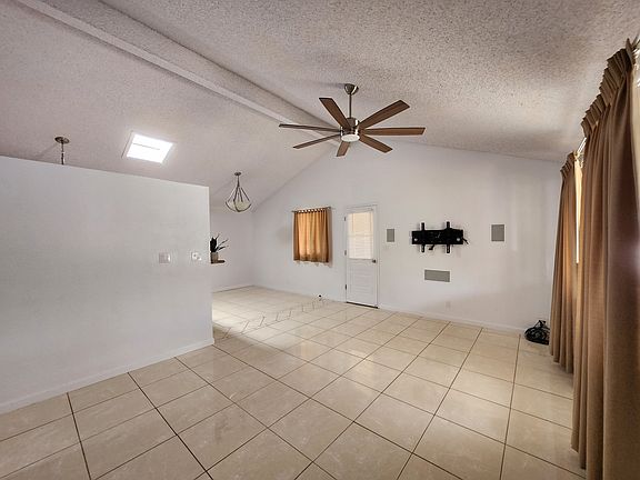 Living & Dining Rooms with AV mount with in-wall speakers
