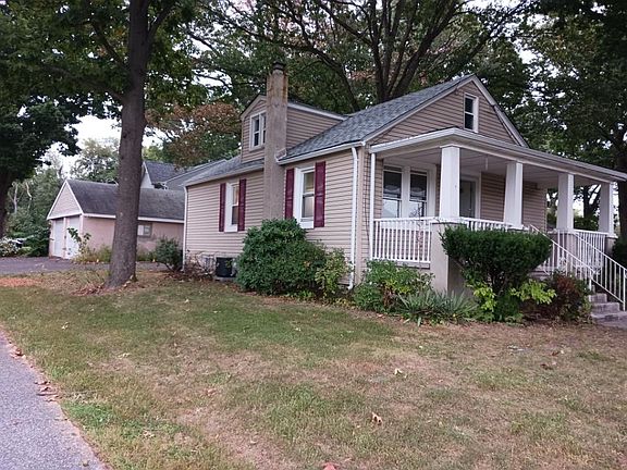 Side of home with detached 2 bay garage