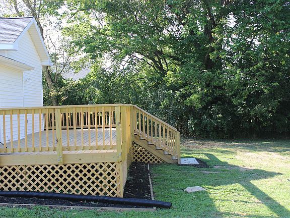 New large deck. Partially covered. Outside lighting and electrical outlets.