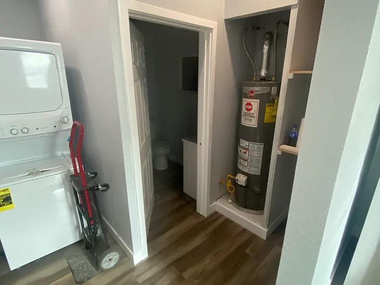 Laundry room and bathroom area _ door has since been added to enclose the water heater