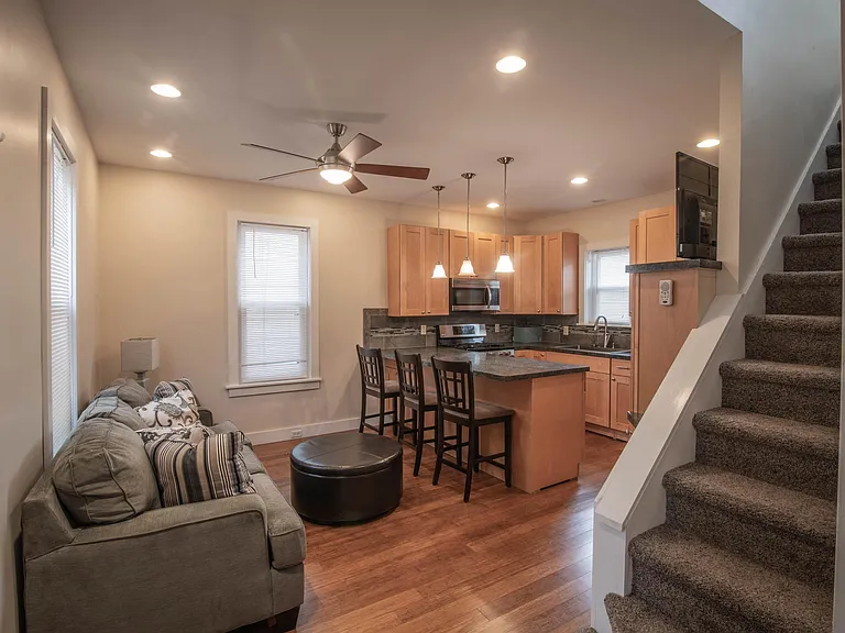 Open kitchen with microwave, dishwasher, five burner stove.