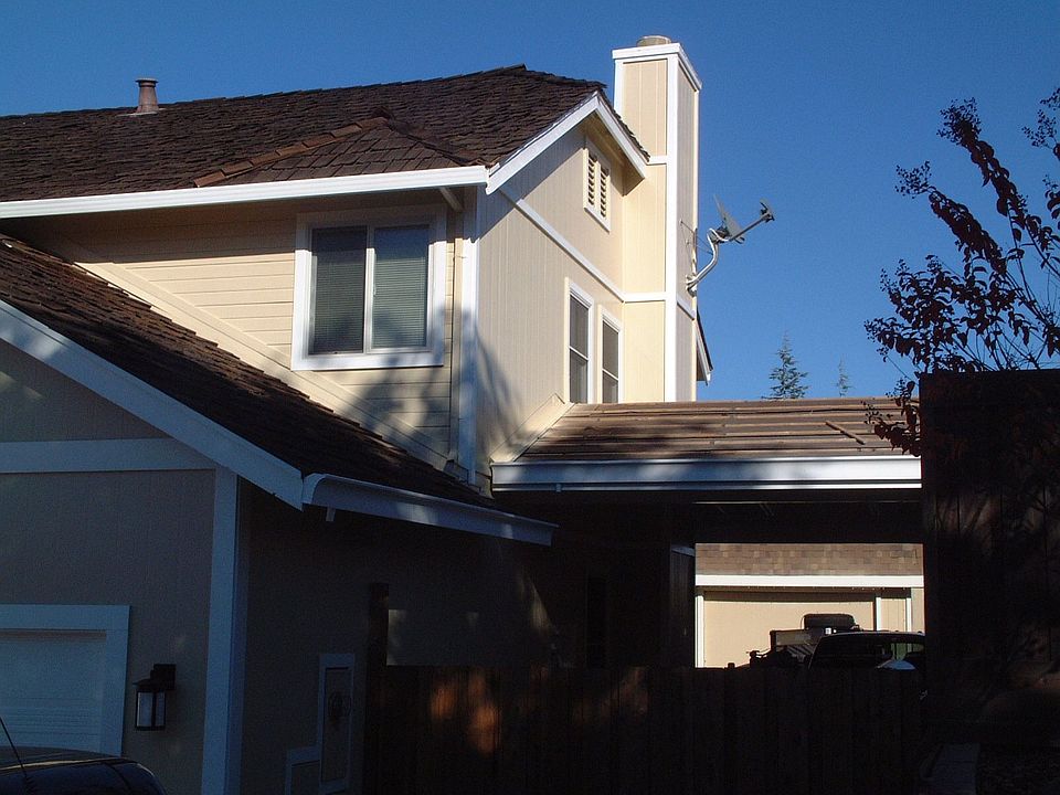 Side Carport with exterior lighting and 900 sq ft workshop with sep 120 amp 