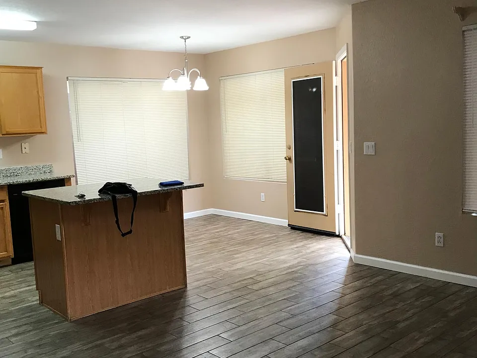 small dinning area. Living room. Tile flooring