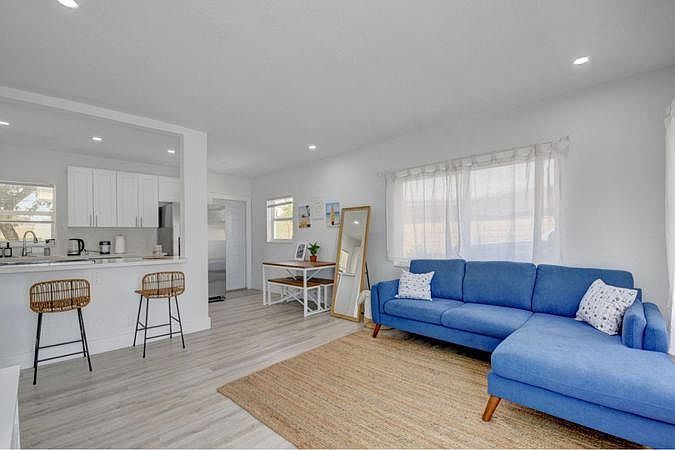 Quartz countertops, breakfast bar and suave grey flooring throughout.