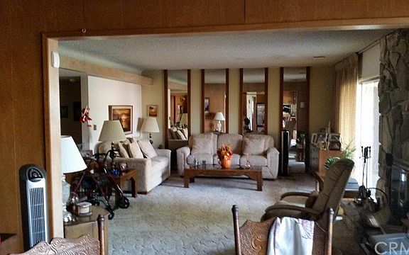 View into living room from den